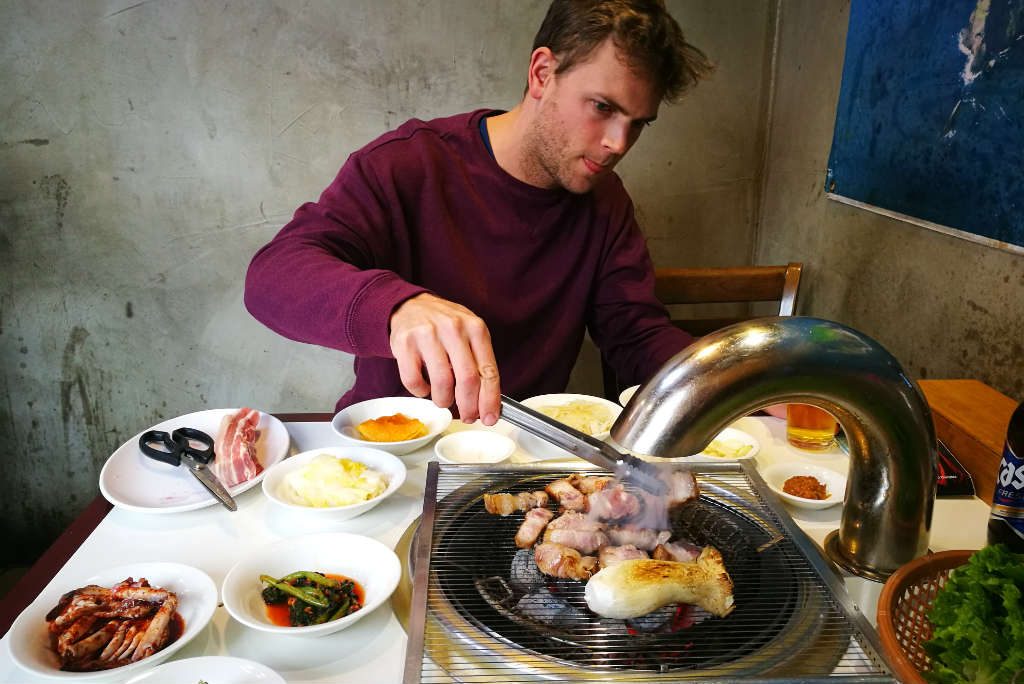 Extreme concentration levels making sure he cooks the meat perfectly