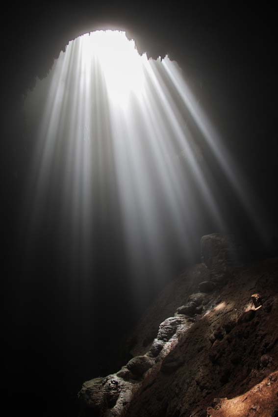 Cave in Indonesia with light beaming through it