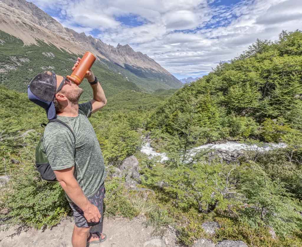 A man drinking water after doing an El Chalten trek
