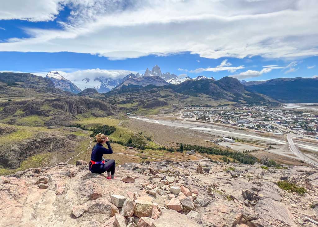 A girl looking onto El Chalten from Mirador de los condores