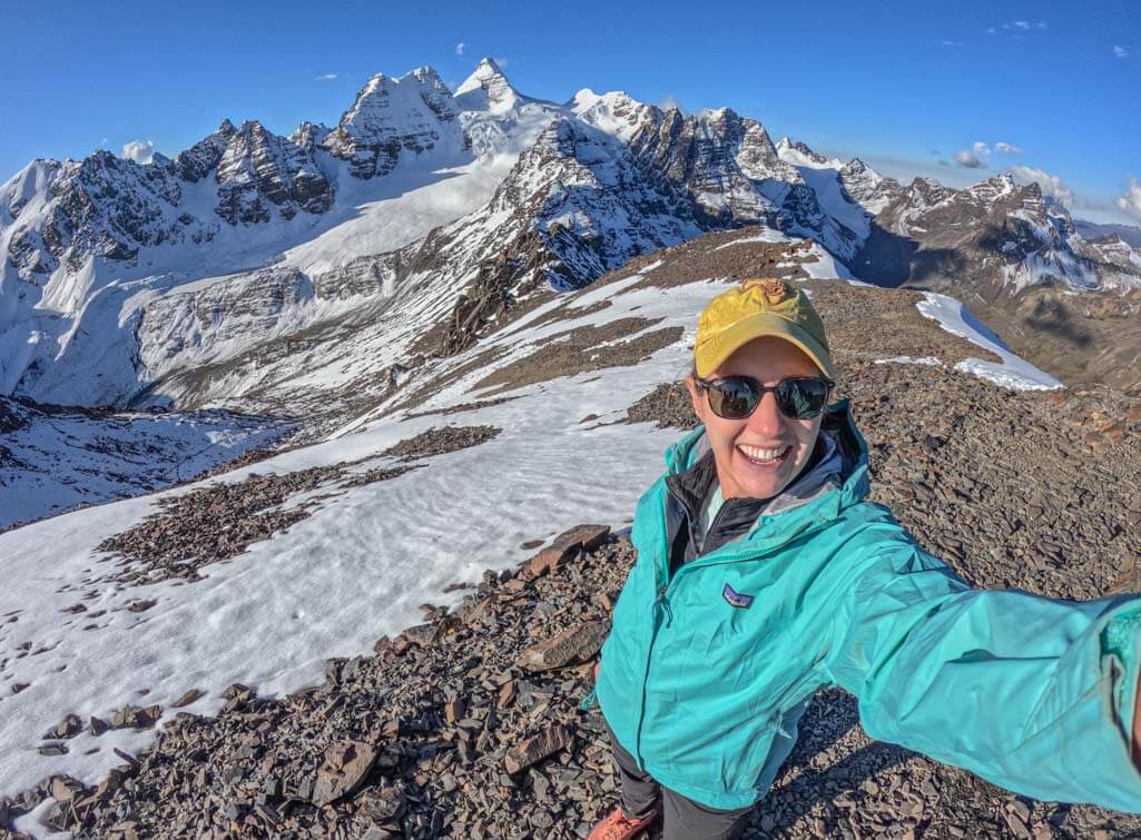 A women taking a selfie at the summit of Pico Austria in Bolivia