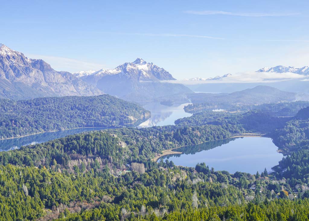 view from the top of a mountain overlooking lakes in bariloche