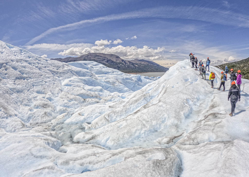 people walking on a glacier during their 10 day patagonia itinerary
