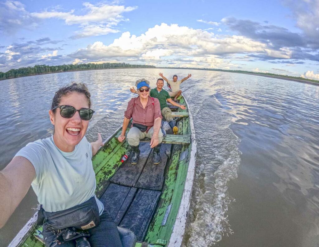 4 people on a small boat on the Amazon River in Peru